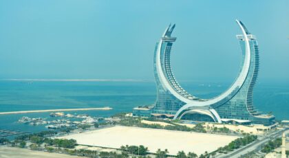 Aerial view of Katara Towers with a marina in Lusail, Doha, Qatar.