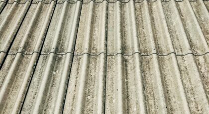 Detailed close-up of a corrugated concrete roof showcasing texture and pattern.