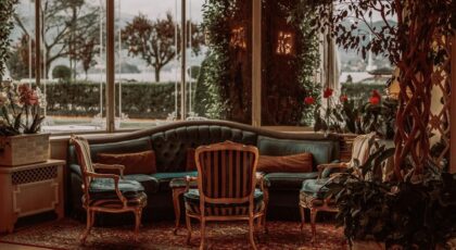 Luxury hotel lobby with views of Lake Maggiore in Stresa, Italy.