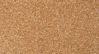 Close-up view of a granular sandstone surface texture, ideal for backgrounds.