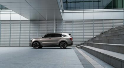 Sleek SUV near architectural steps in a contemporary cityscape in Yongin, South Korea.