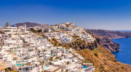 A breathtaking view of Santorini's iconic whitewashed buildings against a vibrant blue sea.
