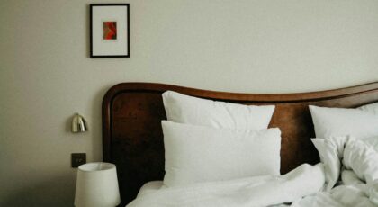 Chic bedroom featuring modern decor with plush pillows and a stylish headboard.