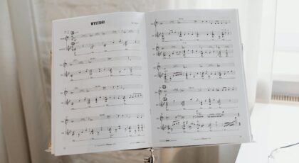 Elegant sheet music on a stand with soft natural light pouring through the window.