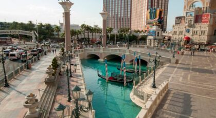 A scenic view of Venetian-style architecture and canal amidst cityscape, perfect for travel inspiration.