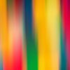 A vibrant abstract image featuring colorful blurred stripes creating a dynamic visual effect.