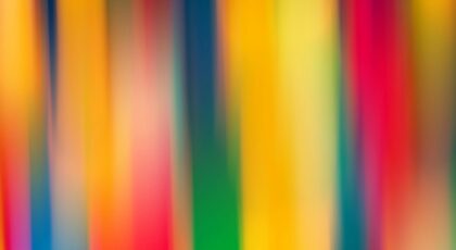 A vibrant abstract image featuring colorful blurred stripes creating a dynamic visual effect.