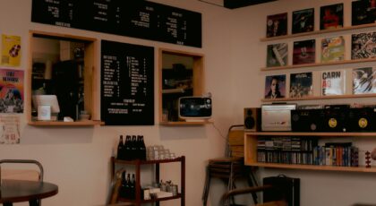 Charming café interior in Geelong featuring vinyl records, blackboard menu, and retro decor.