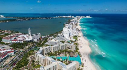 Stunning aerial view of Cancun's beachfront resorts along the vibrant turquoise waters.