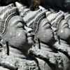 Close-up of detailed Hindu statues in a row, illustrating spirituality and culture.