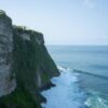 Breathtaking view of Uluwatu Cliffs meeting the Indian Ocean in Bali, Indonesia.
